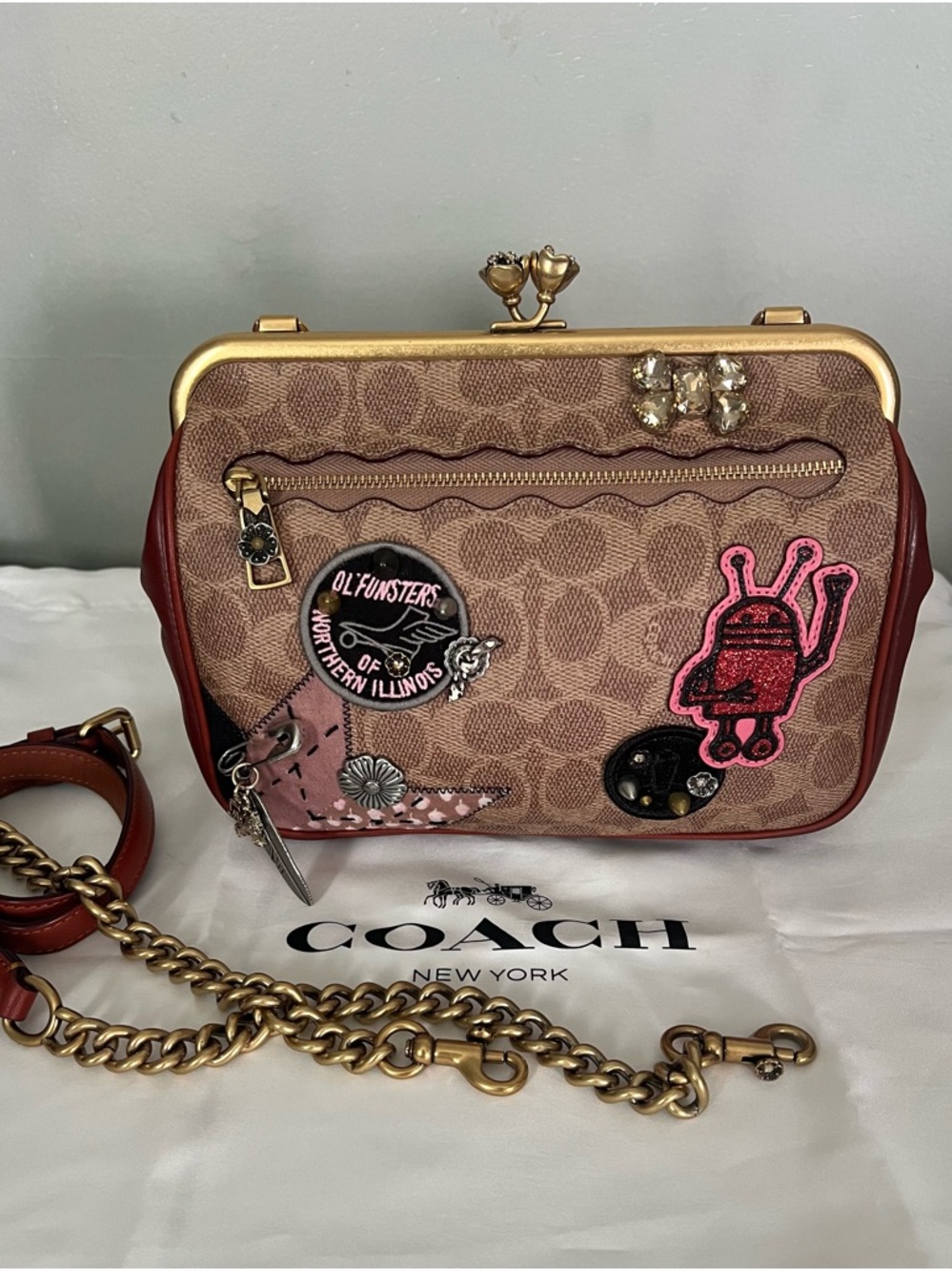 Coach X Keith Haring Kisslock Crossbody
In Signature Patchwork